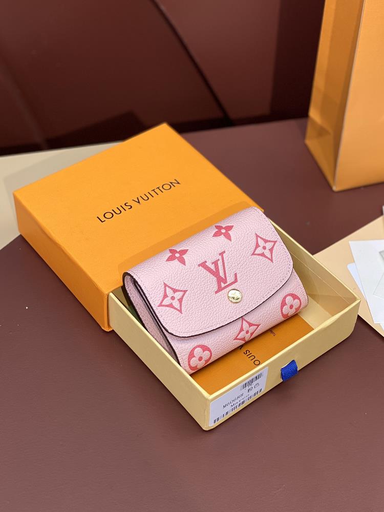 The M60688 pink short wallet is made of soft Monogram Imprente leather and features classic Louis Vuitton Monogram embossing The size of a small bag