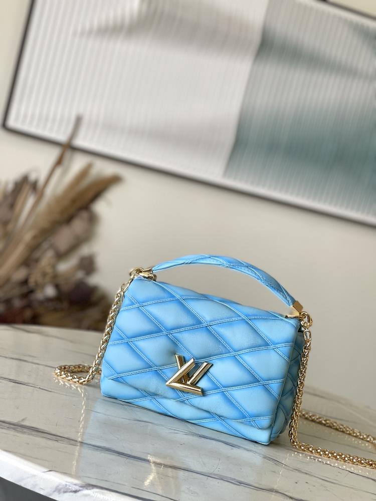 M24185 22891 Aqua BlueDesigner Nicolas Ghesquire interprets the classic diamond stitched pattern of Louis Vuitton suitcases in a colorful way drawing