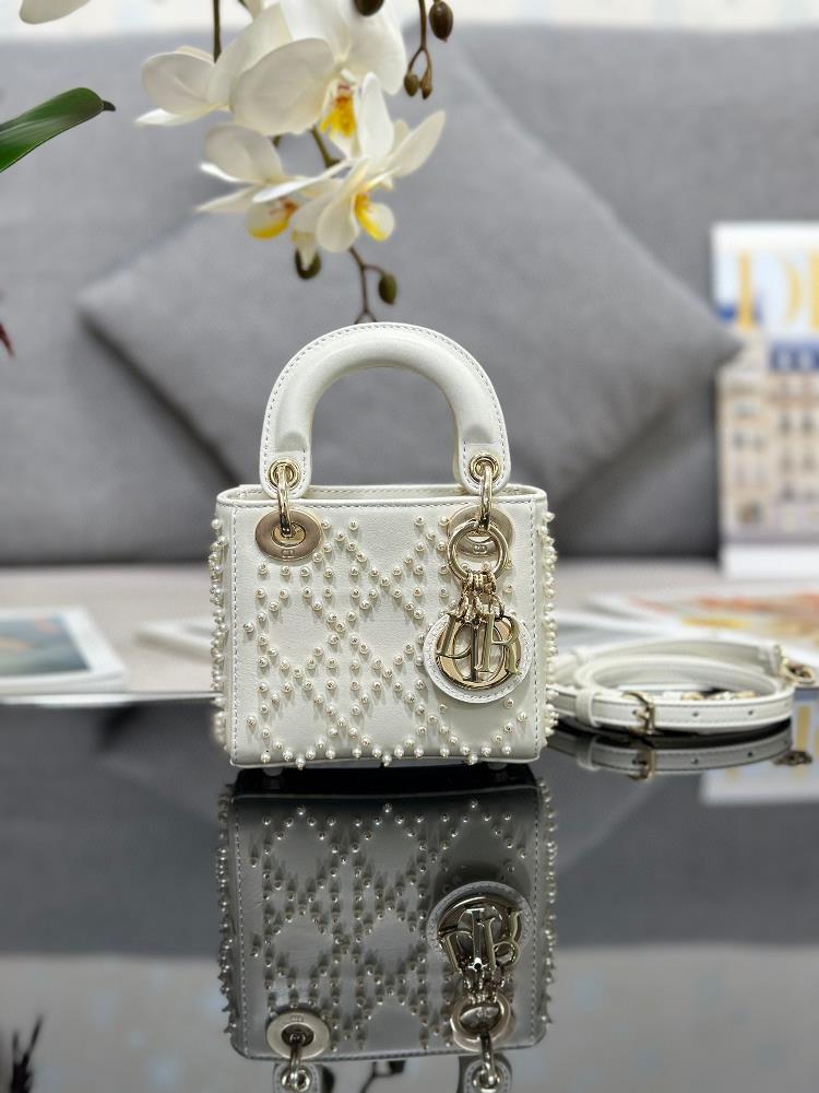 Lady Dior mini embroidered white pearls with sheep tendons inside carefully crafted from white leather embroidered with beads to create the iconic r
