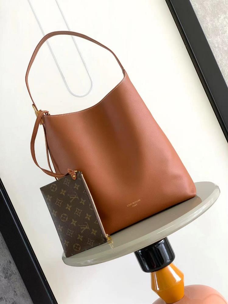 Low Key Hobo Medium Handbag m24974 BrownUsing soft cowhide leather to outline elegant lines paired with a suede lining to release a trendy atmosphere