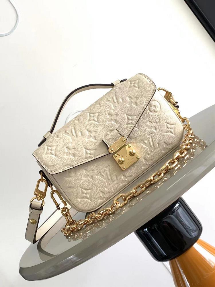 M46595 Milk White This Pochette Mtis East West handbag is made of Monogram Imprente embossed leather showcasing the fusion of brand style and modern