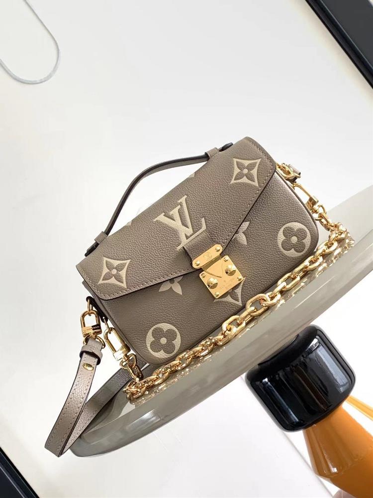 M46595 Gray Screen Printed This Pochette Mtis East West handbag is made of Monogram Imprente embossed leather showcasing the fusion of brand style an
