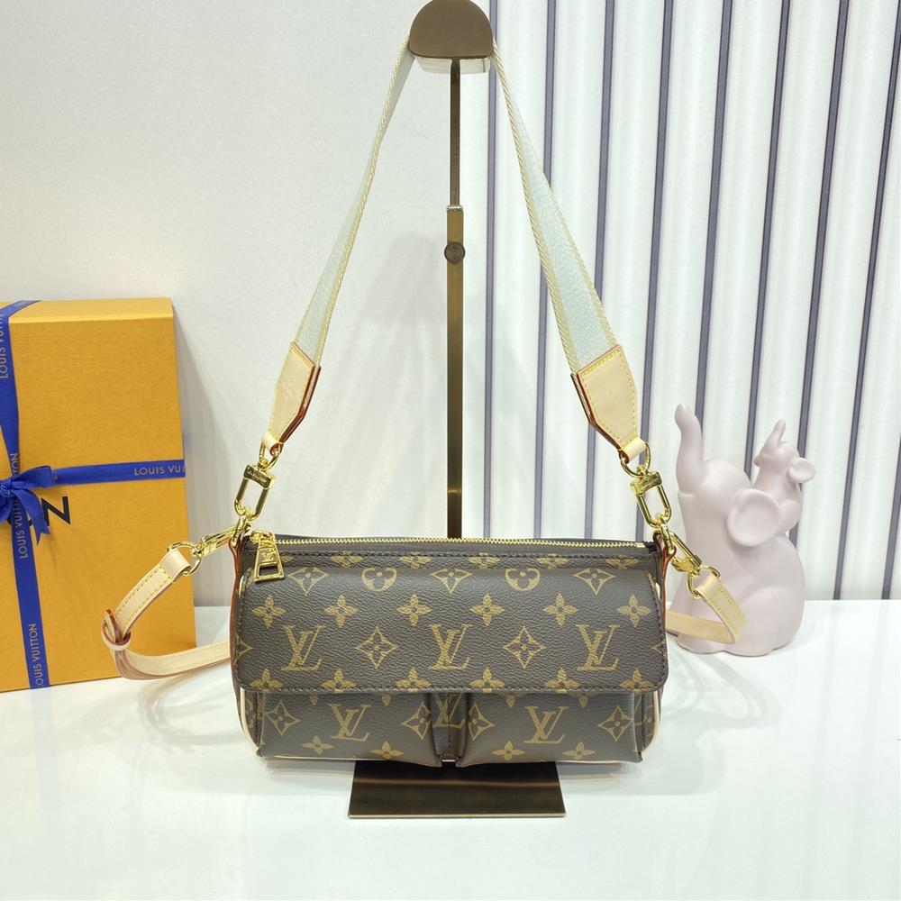 M46999 Vibe Vivacit handbagThe inspiration for the Monogram canvas Vibe handbag comes from the 2003 House Vivacit bag Vibe is compact and practical