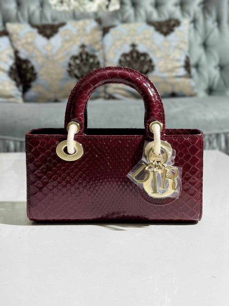 Lady Dior imported python skin paired with gold hardwarePaired with a detachable chain shoulder strap and an adjustable portable or crossbody it is