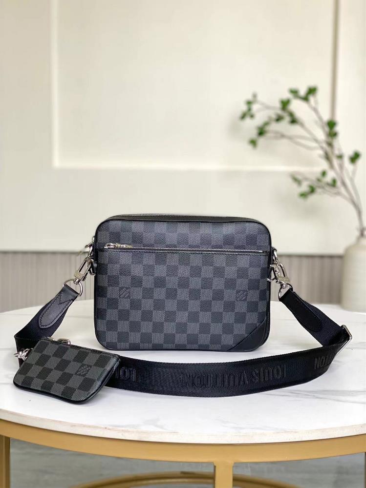 N40519This Trio messenger bag features a classic design reminiscent of Damier Graphite canvas featuring a main pocket a detachable zipper pocket an