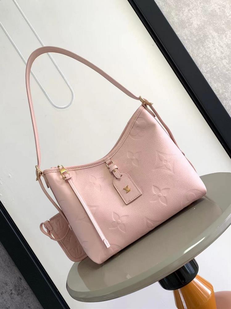 M46288 M46203 Strawberry Ice Cream PowderThe CarryAll small handbag is made of Monogram Imprente embossed leather with a spacious configuration and a