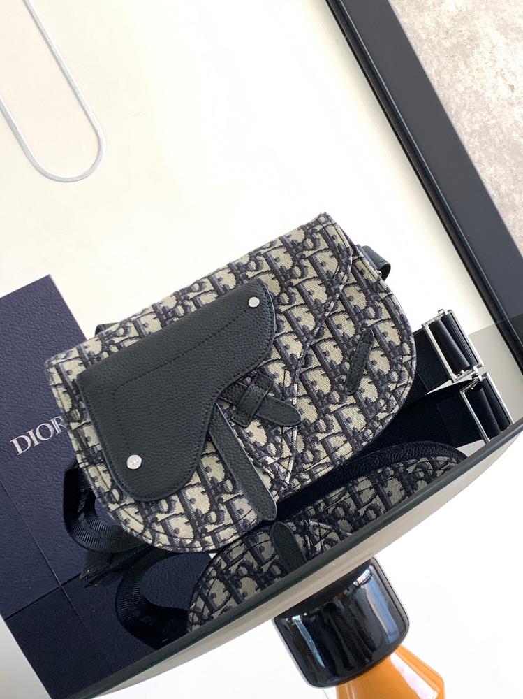 This top of the line saddle handbag is exquisitely designed and an ideal companion for daily use Crafted with beige and black Oblique printed fabric