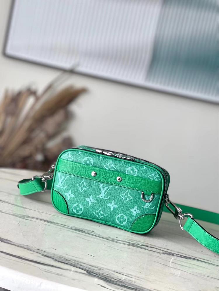 Top of the line original M30997 green this Nano Alpha handbag is from the Taigarama collection featuring Taiga embossed leather and Monogram canvas