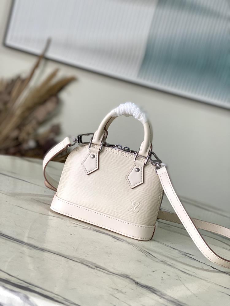 The M82411M81945 meter white Nano Alma handbag is a pocket sized version of the classic Alma handbag made from iconic Epi grain leather The compact
