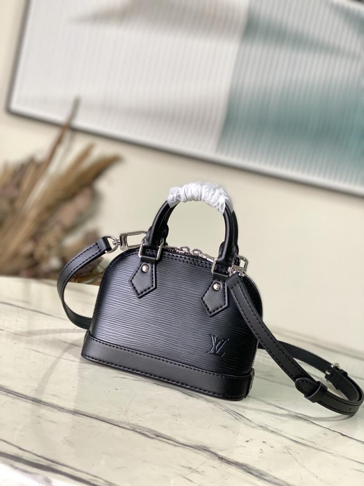 The M81945 black Nano Alma handbag is a pocket sized version of the classic Alma handbag made from iconic Epi grain leather The compact configuratio