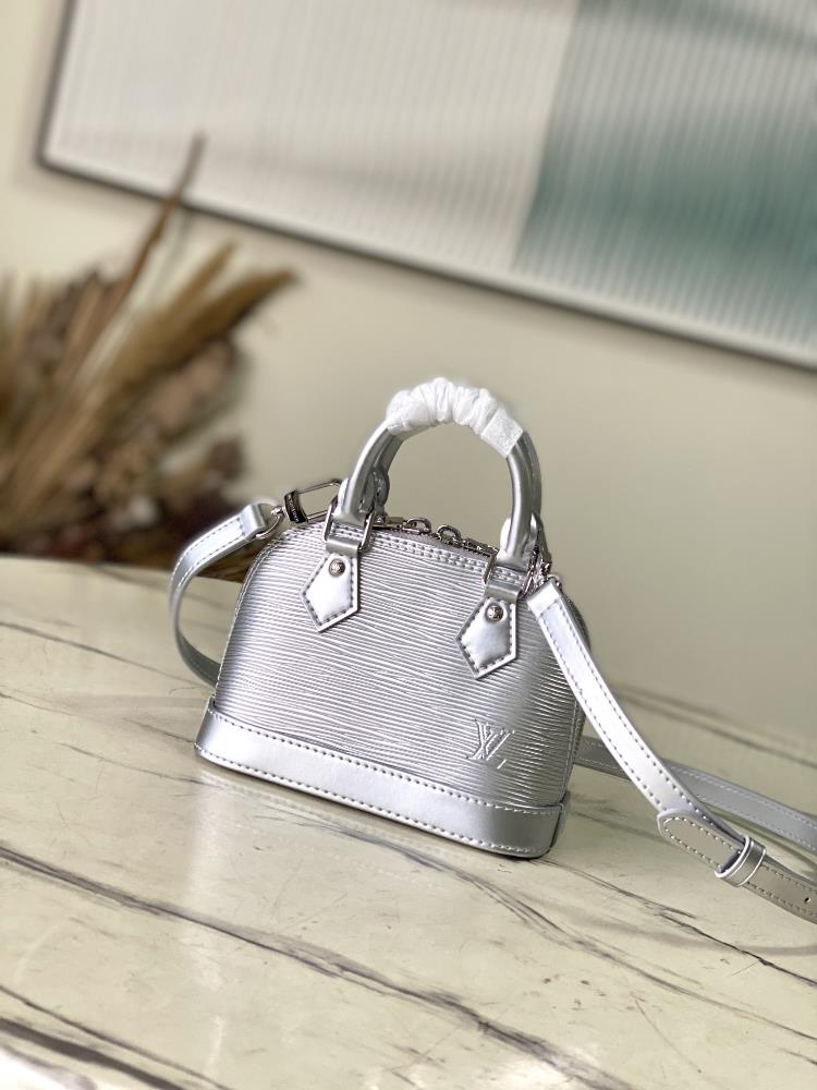 The M82682M81945 Silver Nano Alma handbag is a pocket sized version of the classic Alma handbag made from iconic Epi grain leather The compact confi