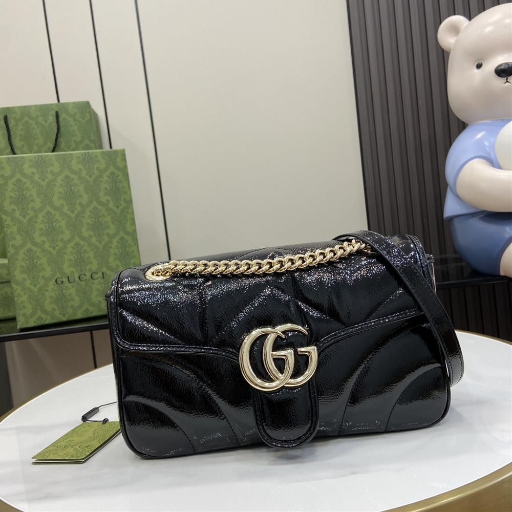 GG Marmont series small shoulder backpack This GG Marmont series shoulder bag features a soft and lined design crafted from black patent leather GG