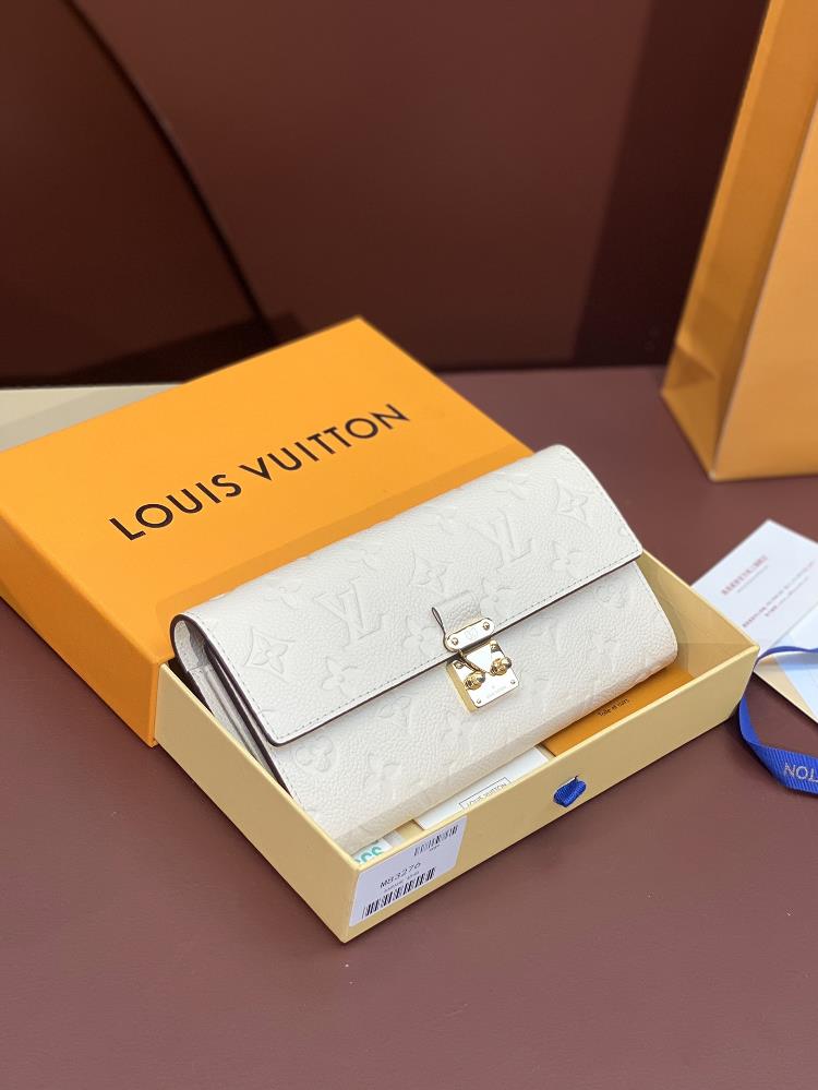 The M83276 white Sarah wallet is made of Monogram Imprente leather and perfectly complements the Metis handbag The inspiration for the golden lock bu