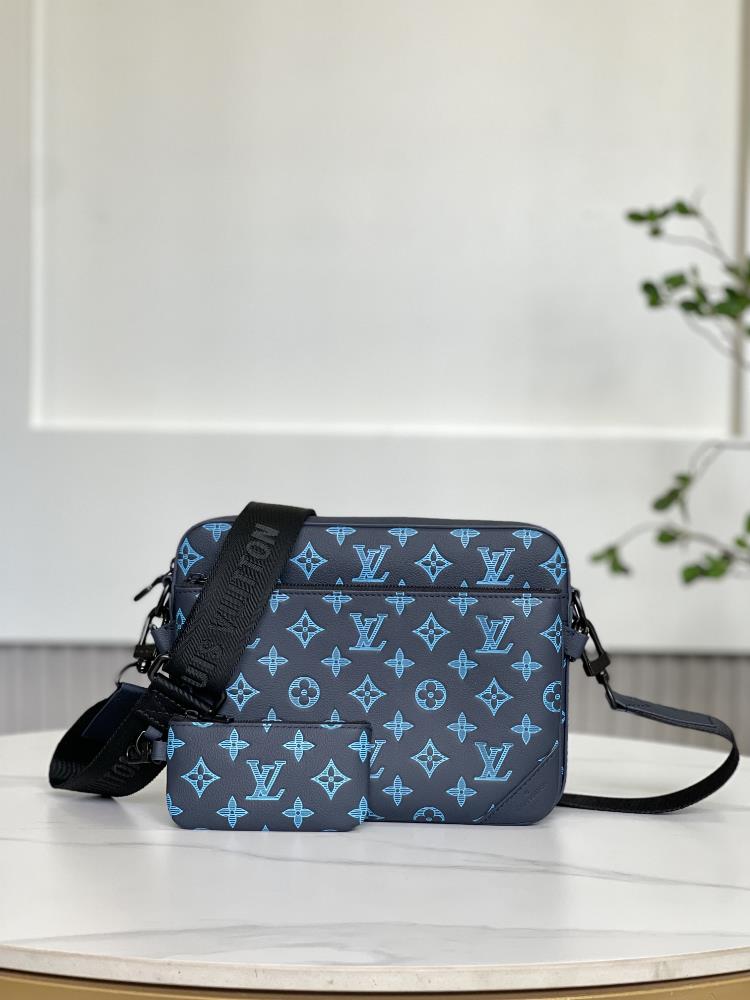 The M46604 Blue Trio Courier Bag is made of Monogram embossed cowhide leather and the small change bag on the zipper front pocket and shoulder strap