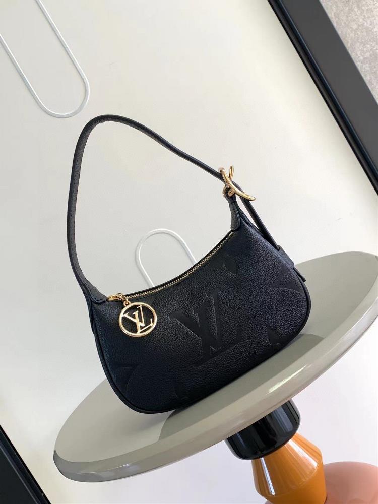 The M82391 M82519 Mini Moon handbag is made of soft Monogram Imprente embossed leather giving attention to details such as the LV Circle logo on the