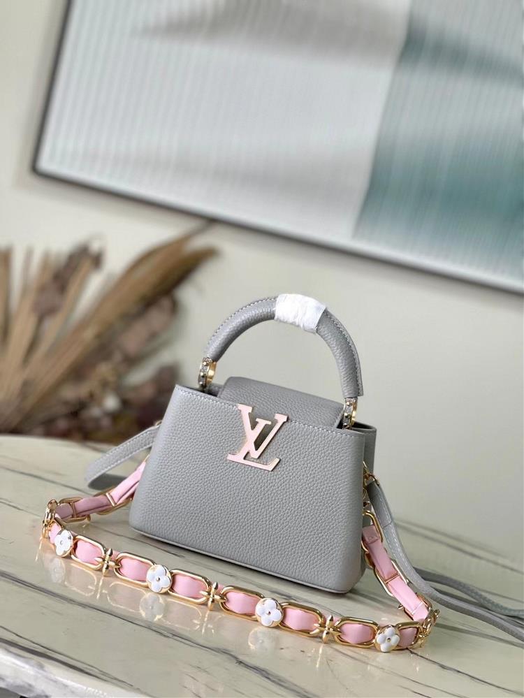 M23280 gray miniThis elegant Capucines mini handbag is paired with a variety of materials and textures made from Aurilon leather and paired with a be