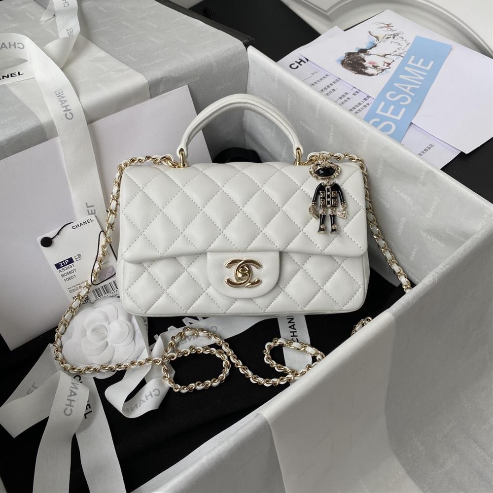 The latest Mini CF handle handbag from the shallow gold Chanel 21K AS2431 features a classic diamond shaped flap bag with a human head ornament The