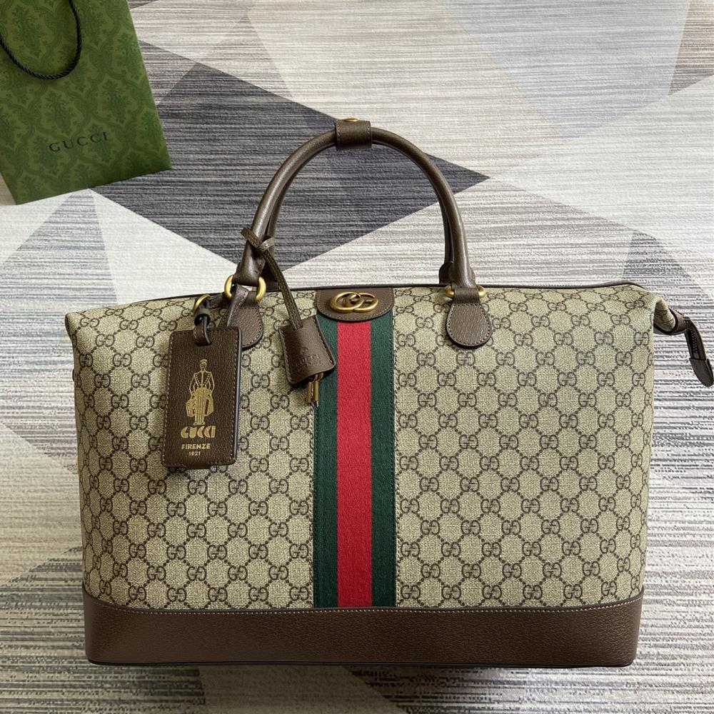 New Gucci Savoy series travel bag with green gift bagThis Gucci Savoy series travel bag is made of iconic beige and ebony GG Supreme canvas material