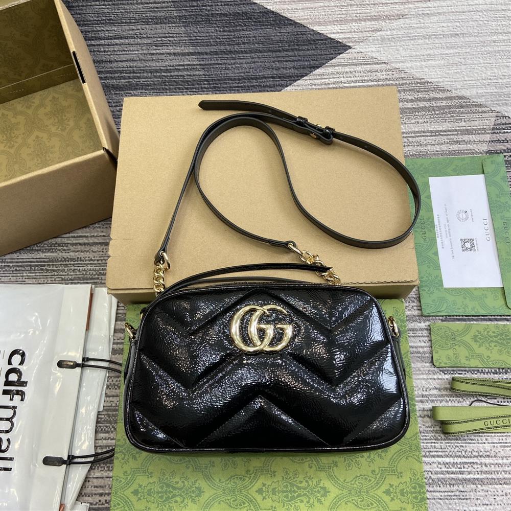 This GG Marmont series shoulder backpack comes with a soft and lined design crafted from black GG Mateless leather It is meticulously adorned with