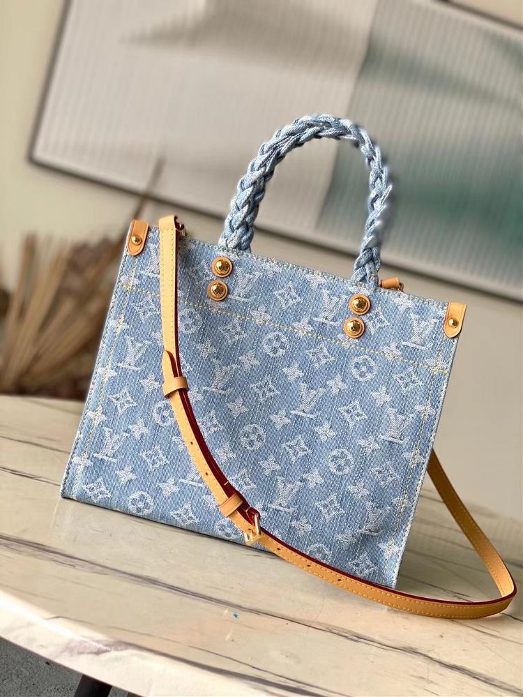The toplevel original M24897 Let Go small tote bag is based on the OnTheGo handbag and conveys a summer vibe through Monogram Denims washed color sc
