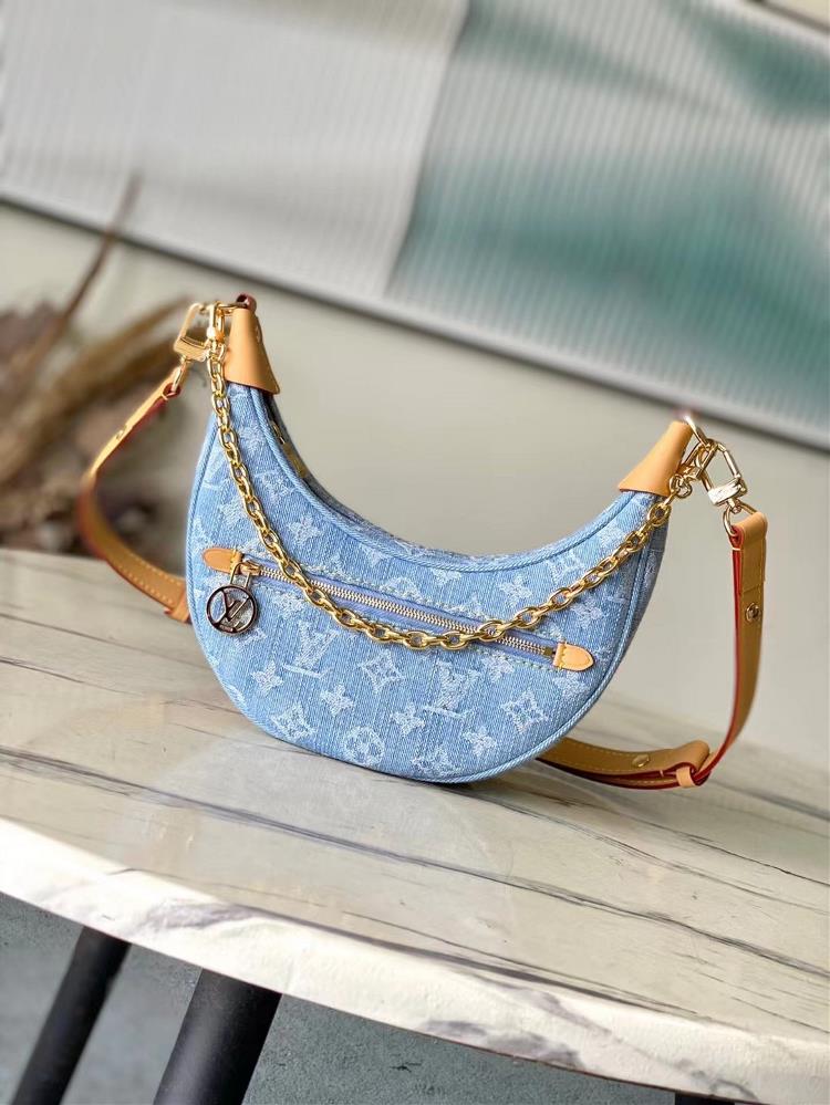 Top of the line original M24846 this Loop small handbag is made of Monogram Denim fabric to showcase the summer trend with a leather corner blocking