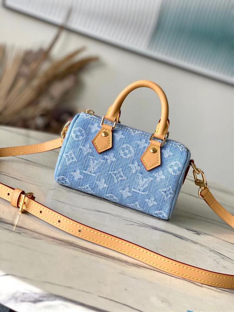 Top of the line original M11212 this Nano Speedy handbag features a Monogram pattern woven from cotton denim presenting a vintage style after bleach