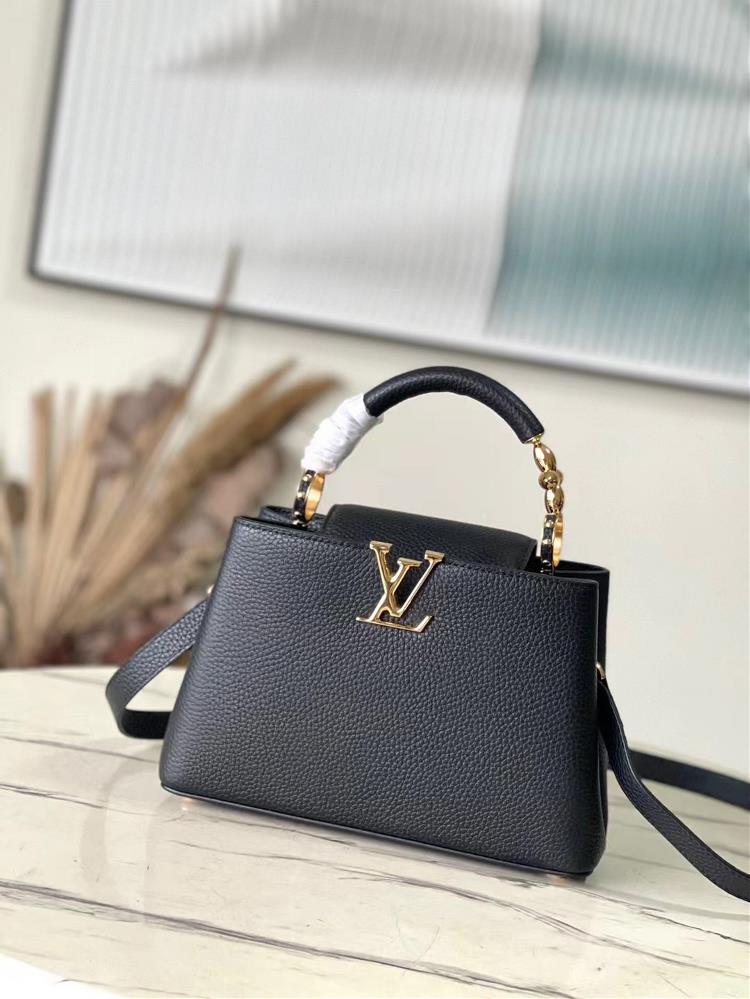 The M24698 black small size Capuchines BB handbag is adorned with Taurillon cowhide accents and shimmering metal parts and features 3D strokes to exp