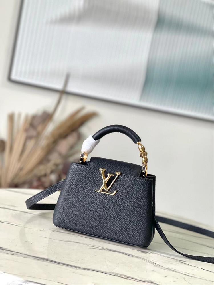 The M23943 black mini Capuchines mini handbag features exquisite Monogram flowers on the handle presenting a threedimensional appearance of the LV l