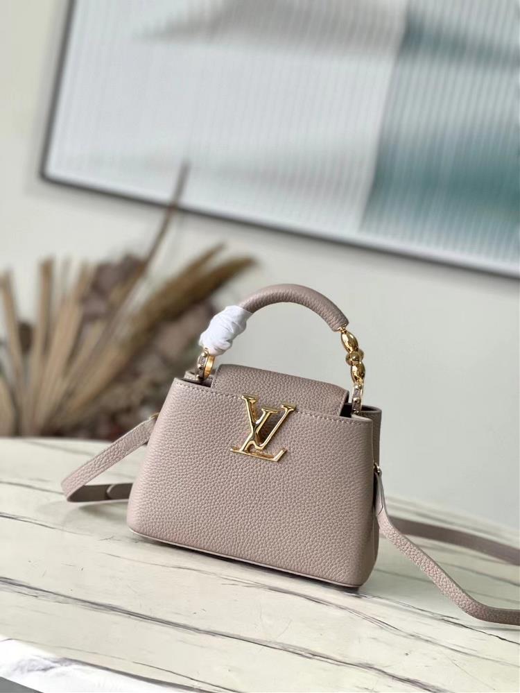 M23943 Elephant Grey Mini This Capuchines mini handbag features exquisite Monogram flowers on the handle presenting a threedimensional appearance of