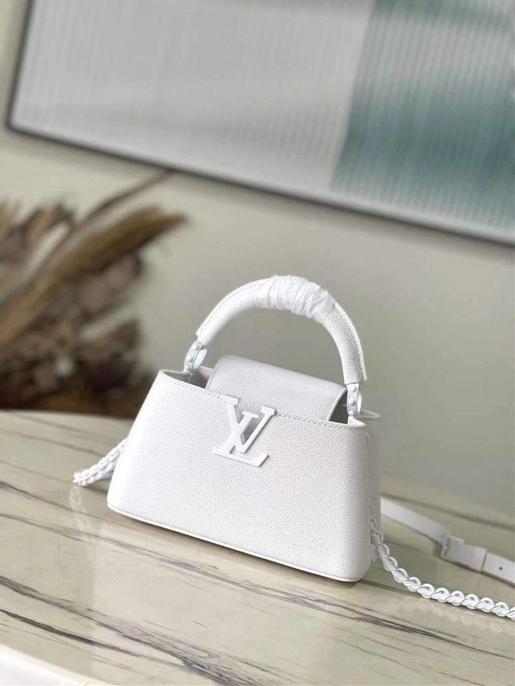 M23956 white mini This Capuchines mini handbag is made of Huamei Niu leather and light metal parts to convey a layered attitude gathering classic el