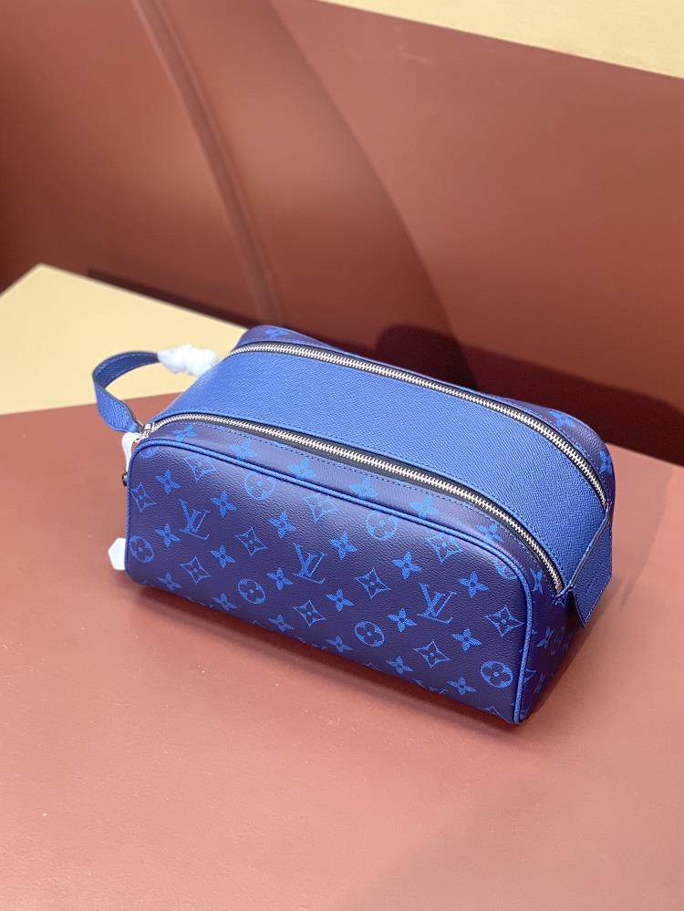 M44494 Blue Flower Makeup Bag Wash Bag Handbag Series This Dopp Kit grooming bag is made of finely grained Taurillon Monogram leather carrying groom