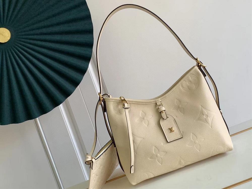 Exclusive live shot of M46288 beige white paired M46203 CarryAll small handbag made of Monogram Imprente embossed leather with ample configuration an