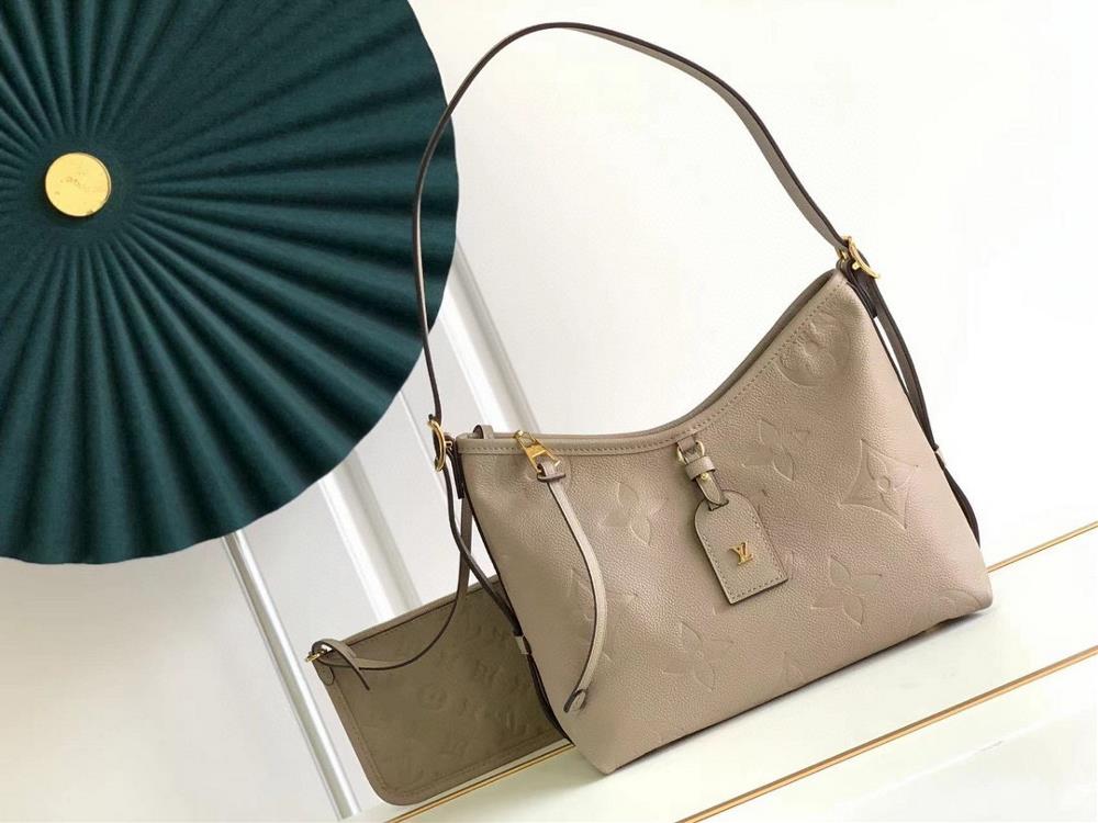 M46288 M46203 matching details CarryAll small handbag is made of Monogram Imprente embossed leather with ample configuration and a neat inner layer