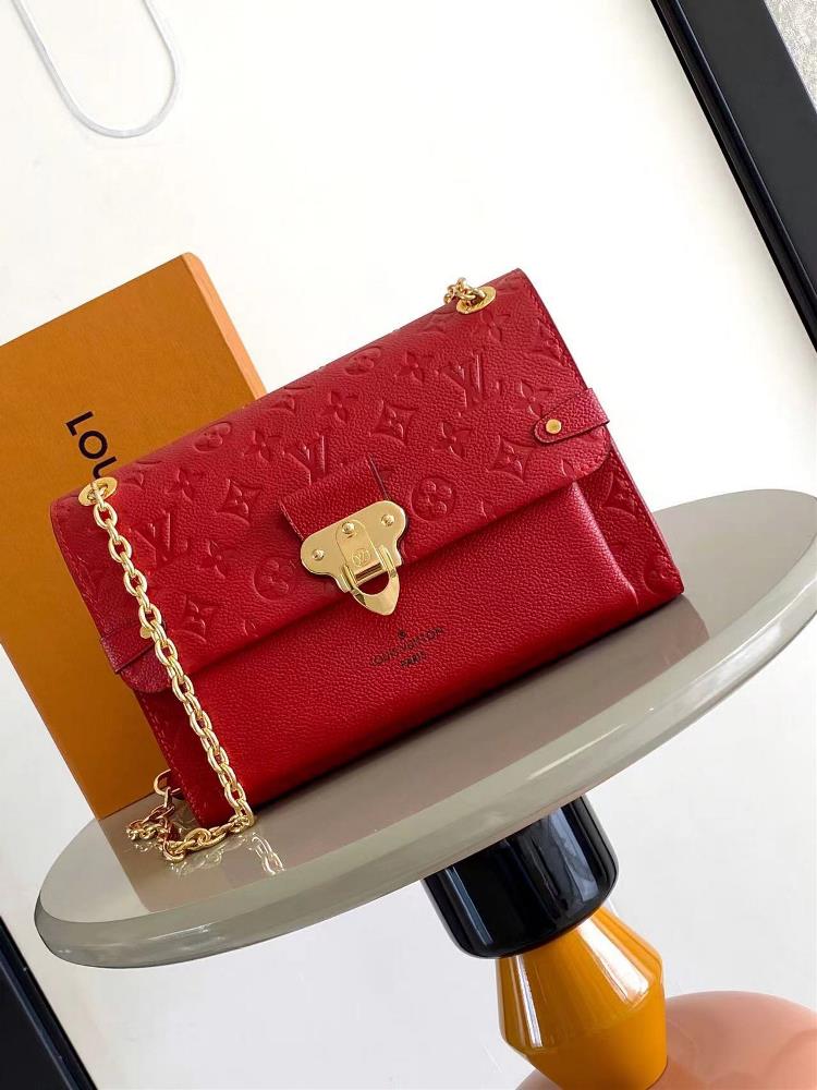 VAVIN small handbag M43931 redCrafted from a blend of smooth and embossed Monogram Imprente cowhide this Vavin small handbag features a bright and ey