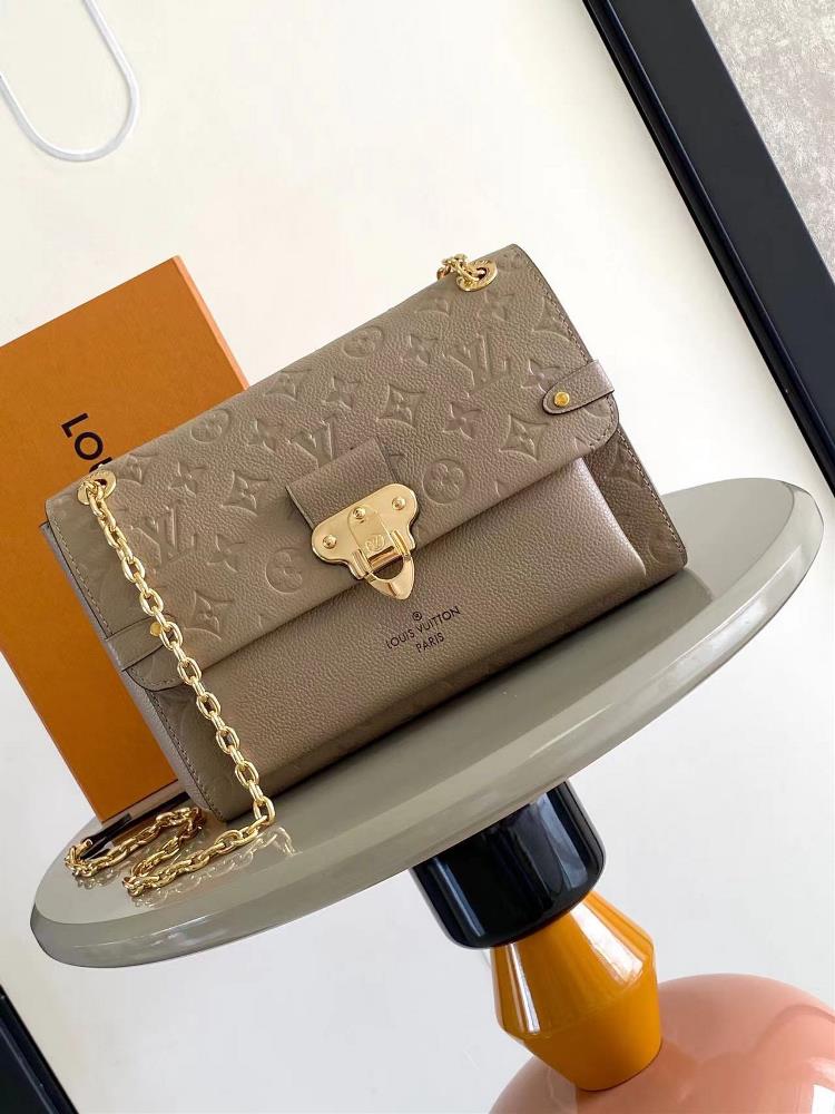VAVIN Small Handbag M43931 ApricotCrafted from a blend of smooth and embossed Monogram Imprente cowhide this Vavin small handbag features a bright an