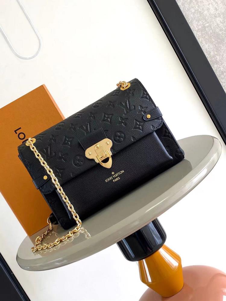 VAVIN small handbag M43931 blackCrafted from a blend of smooth and embossed Monogram Imprente cowhide this Vavin small handbag features a bright and