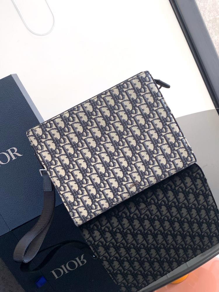 This handbag is Diors flagship item Crafted with beige and black Oblique printed jacquard fabric inspired by Dior archives the front is adorned wi