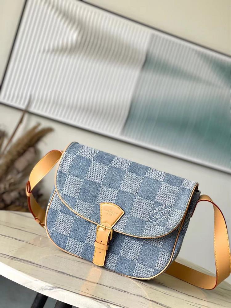 The toplevel original N40743 Montsouris mediumsized mailman bag is made of Damier Denim 3D cotton canvas to create a rounded corridor shape giving