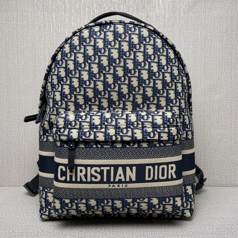 The 9060 Dior Travel backpack cleverly blends Diors classic details with stylish and practical design Crafted with blue jacquard technology fabric a