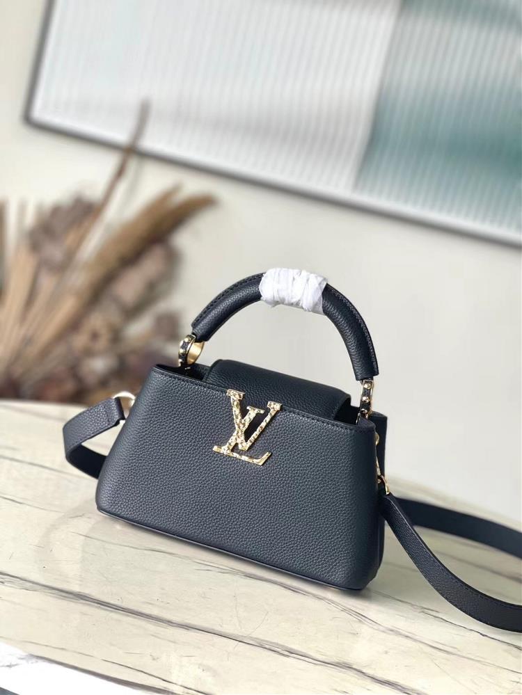 M24664 Black MiniThis Capucines EastWest mini handbag is made of grain leather embellished with LV letters featuring an elegant design that includes