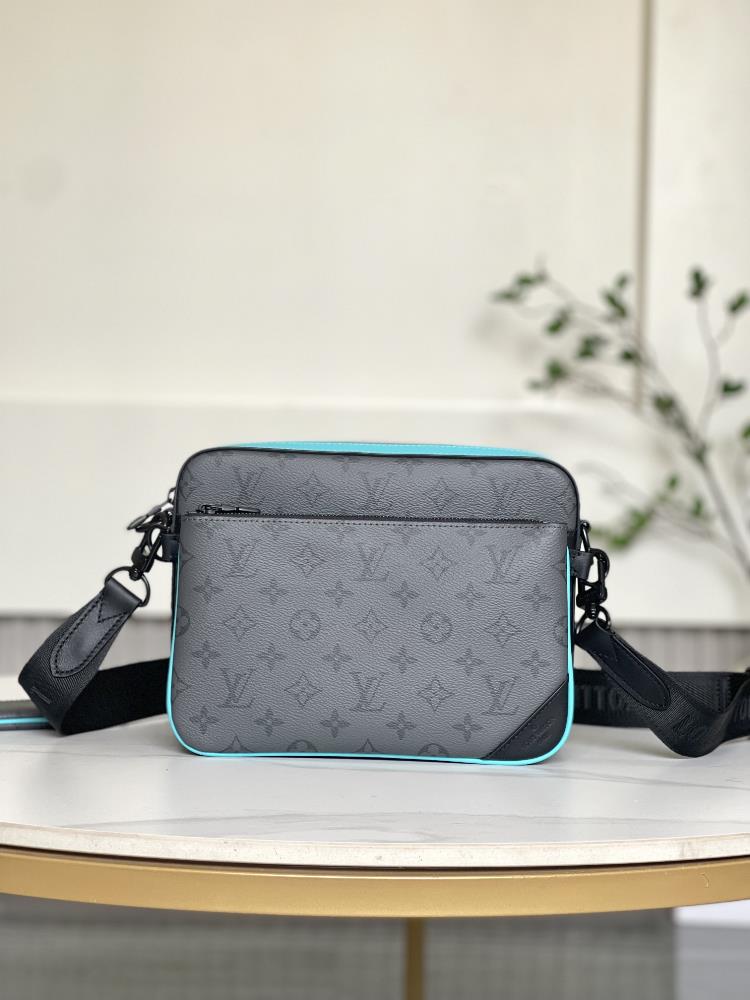 M11648This Trio messenger bag features a three in one design crafted from Monogram Eclipse Reverse canvas and eyecatching details The change bag at