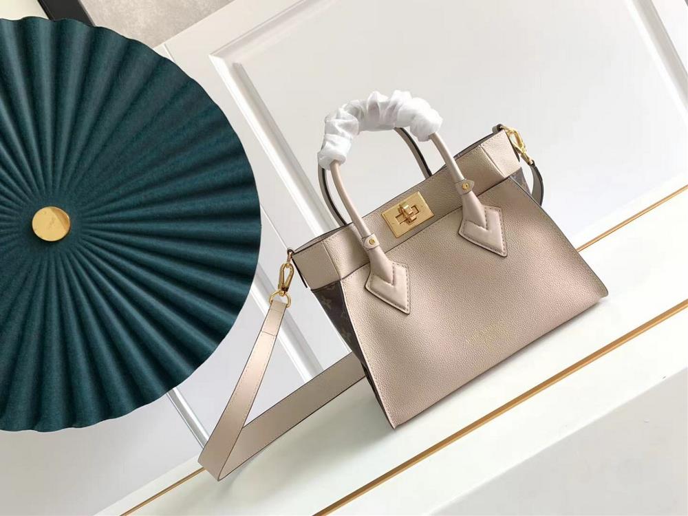 M57729 M57728 ON MY SIDE Small Handbag This On My Side small handbag combines soft calf leather with classic Monogram canvas side lining The distress