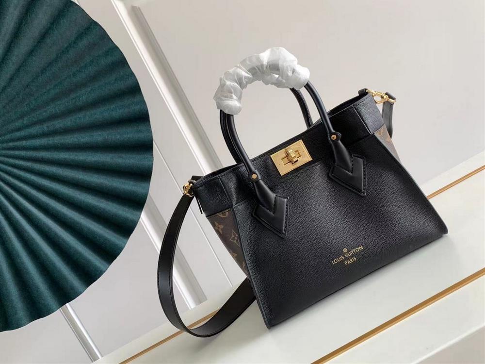 M57729 M57728 ON MY SIDE Small Handbag This On My Side small handbag combines soft calf leather with classic Monogram canvas side lining The distress