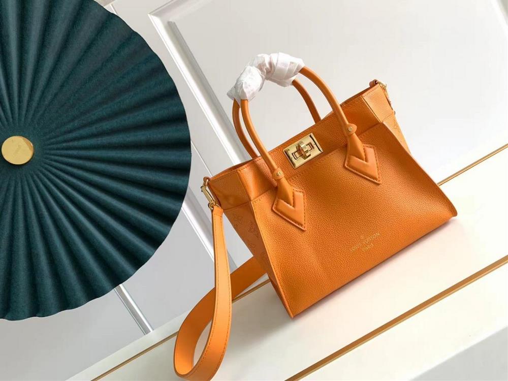 M57729 M57728 ON MY SIDE Small Handbag This On My Side small handbag combines soft calf leather with classic Monogram canvas side lining The distress