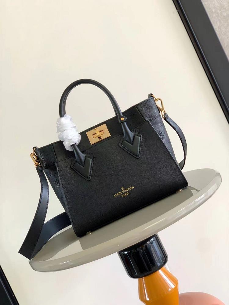 M57729 M57728 ON MY SIDE Small Handbag This On My Side small handbag combines soft calf leather with classic Monogram canvas side lining The distress