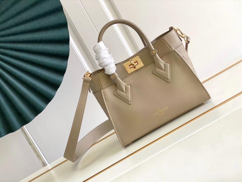 M57729 M57728 ON MY SIDE Small Handbag This On My Side small handbag combines soft calf leather with classic Monogram canvas side lining The distress