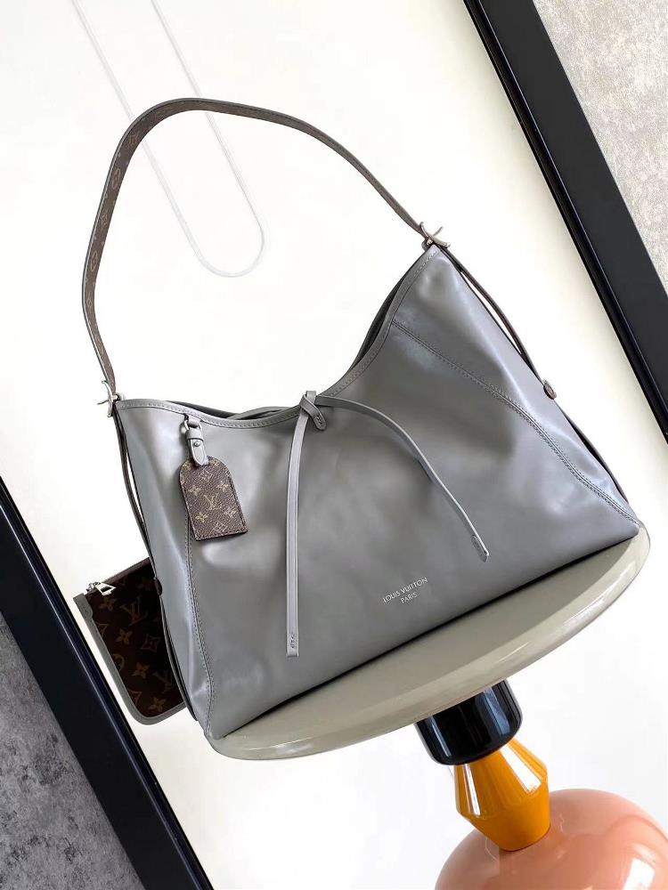 M25143This CarryAll Dark mediumsized handbag is crafted in soft sheepskin to create a fashionable and lazy silhouette adding a striking touch to the