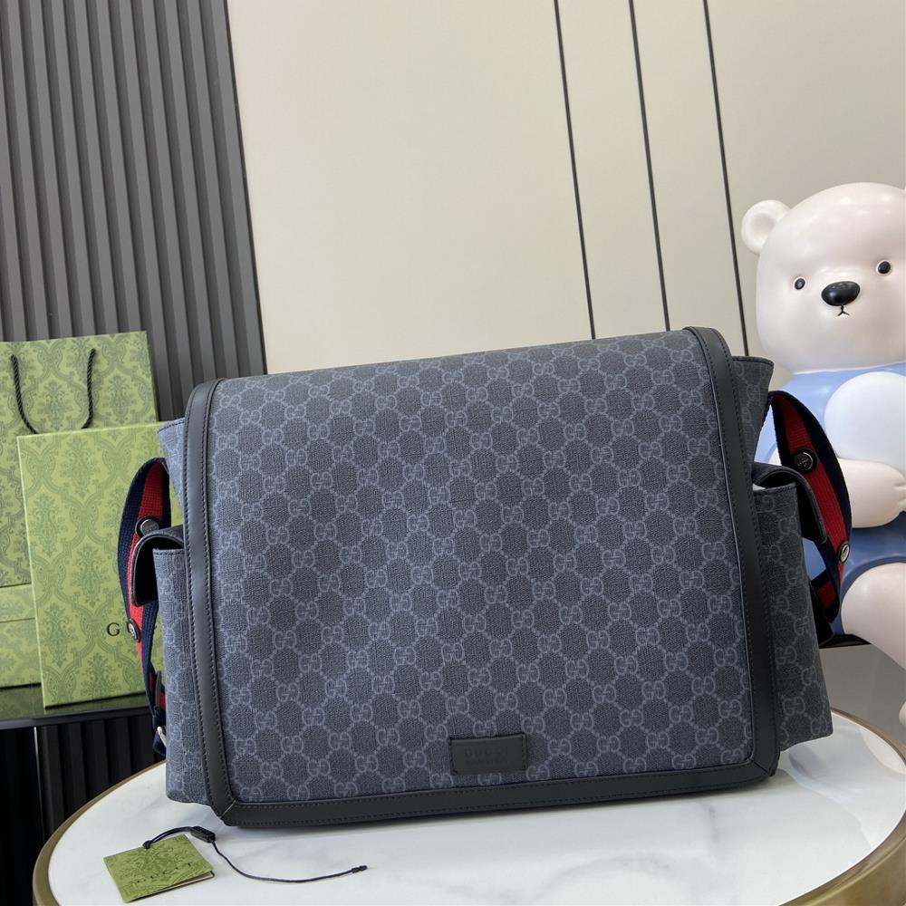 New GG Supreme Mommy BagThe mommy bag is carefully crafted from black grey GG Supreme canvas The GG logo which began to be used in the 1970s evolve