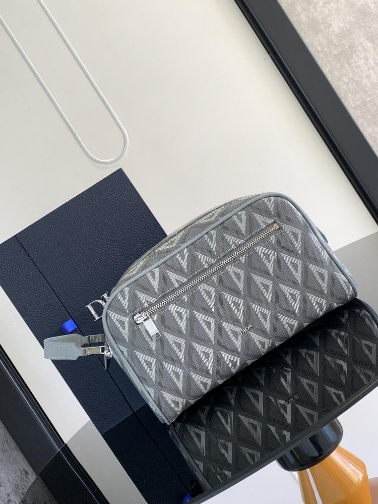 This toiletry bag combines practical functions with a minimalist design Crafted with Dior Grey CD Diamond patterned canvas inspired by Dior archives