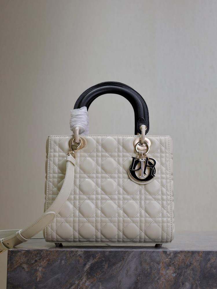 Lady Dior   White against blackFive grid sheepskin adjustable shoulder strapThis handbag embodies Dio rs profound insight into elegance and beauty